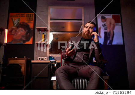 bearded macho man, barber male indoors 71565294