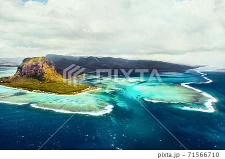 A bird's-eye view of Le Morne Brabant, a UNESCO world heritage site.Coral reef of the island of Mauritius.Storm cloud A bird's-eye view of Le Morne Brabant, a UNESCO world heritage site.Coral reef of the island of Mauritius.Storm cloud 71566710