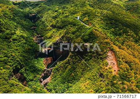 Aerial view from above of the Tamarin waterfall seven cascades in the tropical jungles of the island of Mauritius Aerial view from above of the Tamarin waterfall seven cascades in the tropical jungles of the island of Mauritius 71566717