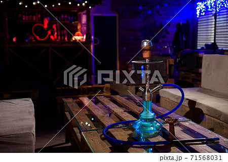 Hookah on the background of a bar, light, smoke, smog 71568031