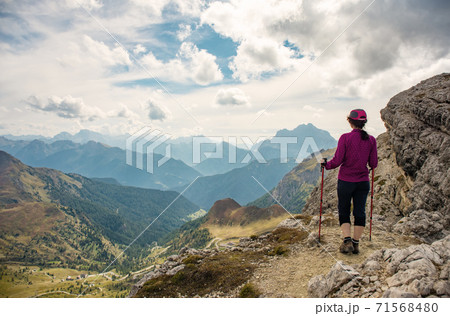 Sporty Young woman on mountain trail Dolomites Mountains, Italy Sporty Young woman on mountain trail Dolomites Mountains, Italy 71568480