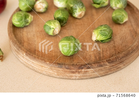 Fresh Brussels sprouts on a cutting board Fresh Brussels sprouts on a cutting board 71568640
