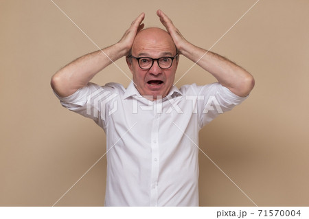 scream of shocked and scared young man scream of shocked and scared young man 71570004