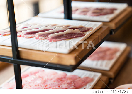 Raw duck meat in Japanese restaurant. This restaurant specializes in grilled meat. 71571787