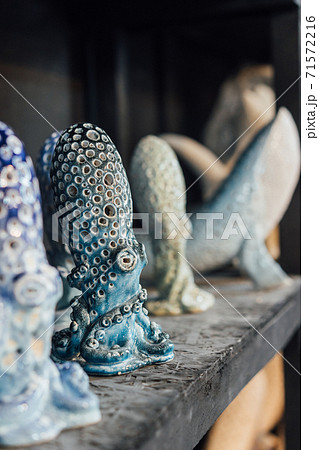 Finished pottery stands on a shelf in a pottery workshop Finished pottery stands on a shelf in a pottery workshop 71572216