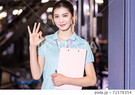 Woman gym trainer 71576354