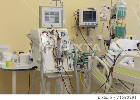 Dialysis machine, to which patient is connected in intensive care unit in hospital. The patient fell ill with a new type of coronavirus covid-19. Dialysis machine, to which patient is connected in intensive care unit in hospital. The patient fell ill with a new type of coronavirus covid-19. 71580591