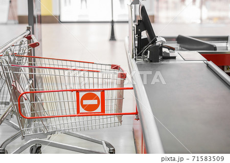 Empty cash desk with closed way border in supermarket. 71583509