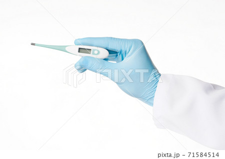 Human hand in a blue latex medical glove hold a thermometer 71584514