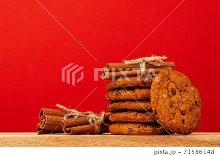 Chocolate chip cookies in stack on red background 71586148