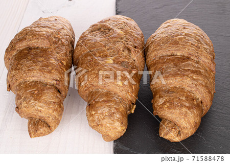 Baked croissant on white wood Baked croissant on white wood 71588478