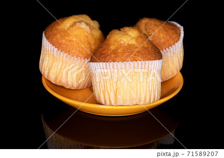 Baked muffin on black glass Baked muffin on black glass 71589207
