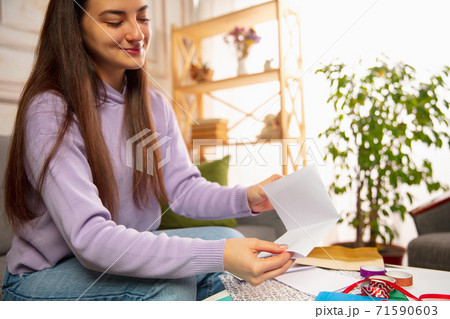 Woman writing letter, greeting card for New Year and Christmas 2021 for friends or family 71590603