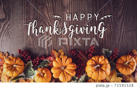 Thanksgiving background decoration from dry leaves and pumpkin on old wooden background. Flat lay, top view for Autumn, fall, Thanksgiving concept. 71591528