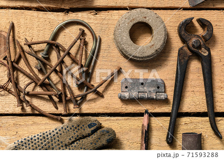 Old vintage household hand tools still life on a wooden background in a DIY and repair concept 71593288