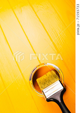 Yellow paint on freshly painted wooden board Yellow paint on freshly painted wooden board 71593733