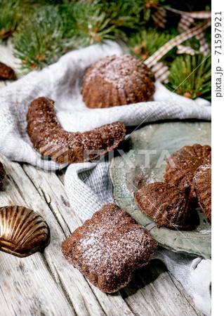 Christmas shortcrust cookies chocolate crescents with fir tree, molds, xmas decorations. 71597921