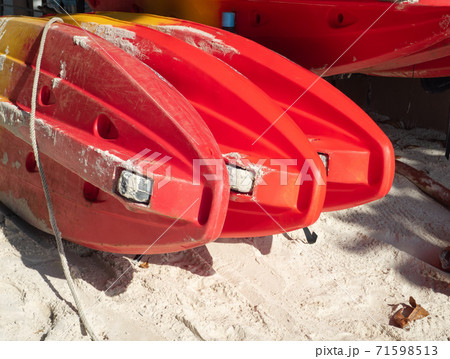 Red canoe or kayak boat on the beach. Red canoe or kayak boat on the beach. 71598513