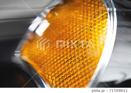 Macro close-up element of reflector of new headlight of car headlight in defocus. Car background with soft focus Macro close-up element of reflector of new headlight of car headlight in defocus. Car background with soft focus 71599631