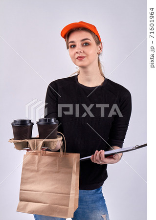 European female courier with coffee and paper package. 71601964