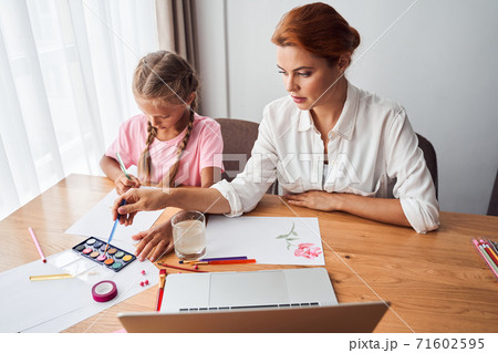 Kid girl learning painting 71602595