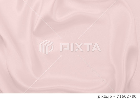 Smooth elegant pink silk or satin texture as wedding background. Luxurious background design Smooth elegant pink silk or satin texture as wedding background. Luxurious background design 71602780