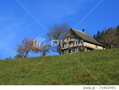 Traditional old farm house in Schwyz Canton, Switzerland. Traditional old farm house in Schwyz Canton, Switzerland. 71603491