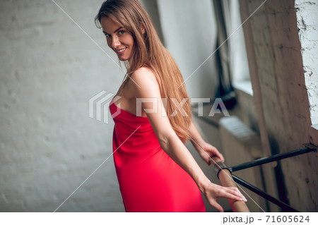 Woman stretching her back while having a dance rehearsal 71605624