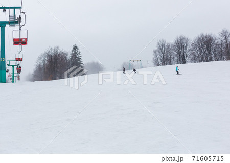 People skiing on a slope. People skiing on a slope. 71605715