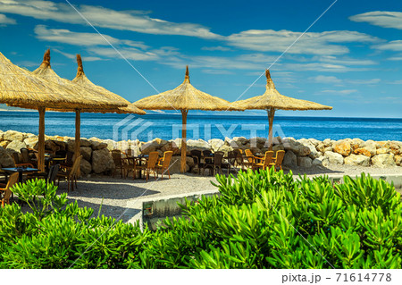 Spectacular outdoor tropical beach bar, Brela, Dalmatia, Croatia, Europe Spectacular outdoor tropical beach bar, Brela, Dalmatia, Croatia, Europe 71614778