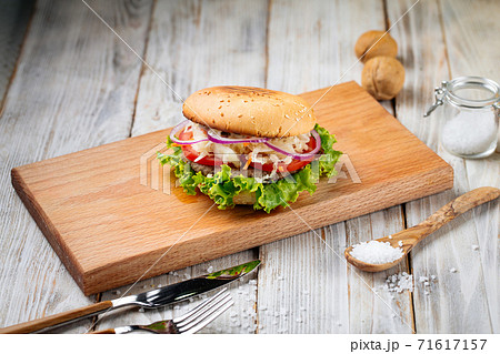 Side view on hamburger with sauerkraut and lettuce Side view on hamburger with sauerkraut and lettuce 71617157