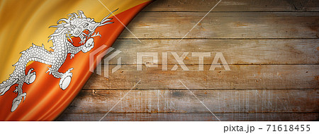 Bhutan flag on vintage wood wall banner 71618455