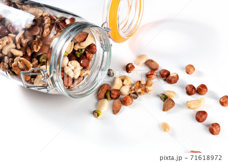 Many different nuts in a mason jar Many different nuts in a mason jar 71618972