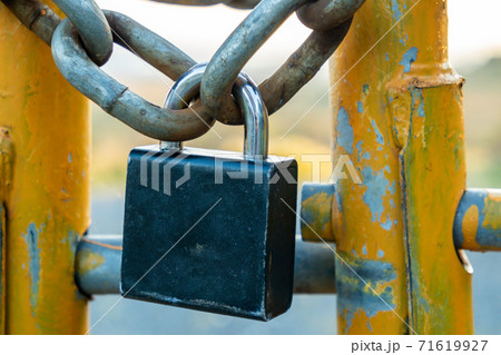 Padlock and chain at gate in wild Ireland Padlock and chain at gate in wild Ireland 71619927