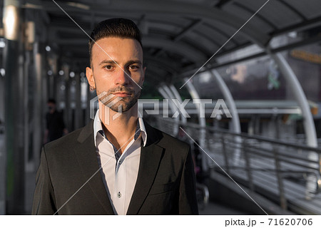 Portrait of handsome young businessman outdoors in city Portrait of handsome young businessman outdoors in city 71620706