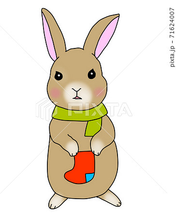 靴下を持ちサンタを待つウサギのイラスト素材