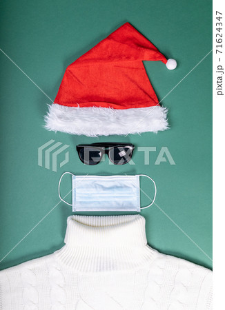 red hat mask and white sweater flat lay shape of Santa Slaus 71624347