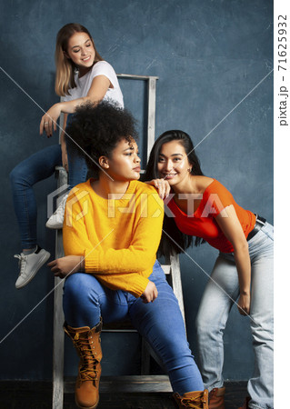 diverse nation girls group, teenage friends company cheerful having fun, happy smiling, cute posing on blue background, lifestyle people concept 71625932