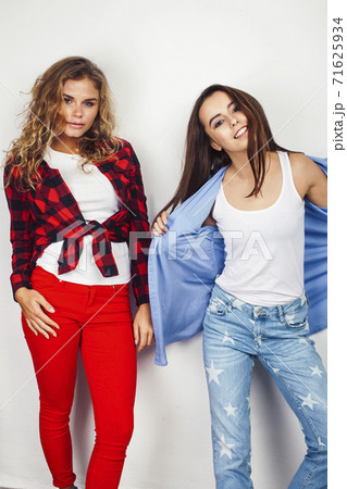 best friends teenage girls together having fun, posing emotional on white background, besties happy smiling, lifestyle people concept, blond and brunette multi nations 71625934