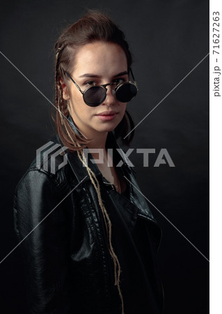 Beautiful stylish woman in a black leather jacket. 71627263