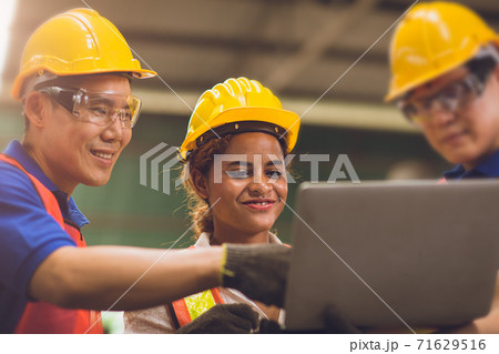 engineer team mix race brainstorming join working together in heavy industry 71629516