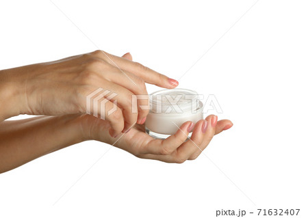 Female hands hold jar with cosmetic cream, isolated on white background 71632407