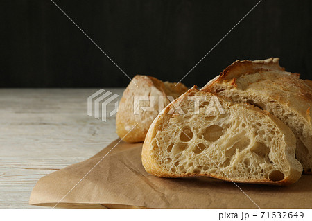 Fresh baked bread on wooden background, space for text  71632649