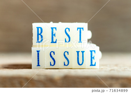 Letter block with blue color word best issue on wood background 71634899