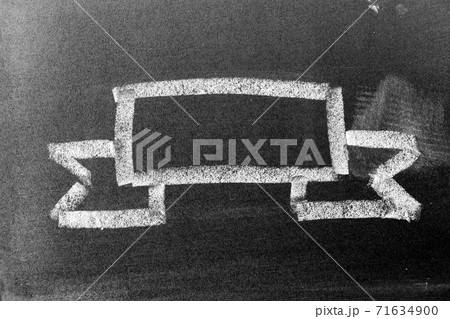 White chalk hand drawing in blank award ribbon banner shape on blackboard background 71634900