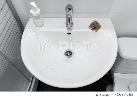 Hair loss. Hair in the sink after combing the head 71637662
