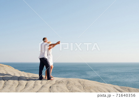 Young couple watching the sea 71640356
