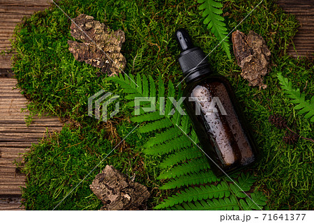 Natural cosmetic concept with glass bottle 71641377