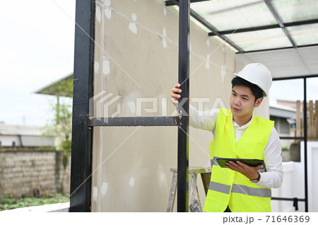 Architecture man checking building with tablet computer,Building inspector concept. 71646369