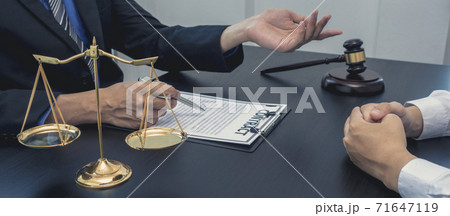 Lawyer or counselor works in the courtroom and negotiates with clients or complainants seeking justice on land encroachment, Law that validity and justice concept. Lawyer or counselor works in the courtroom and negotiates with clients or complainants seeking justice on land encroachment, Law that validity and justice concept. 71647119